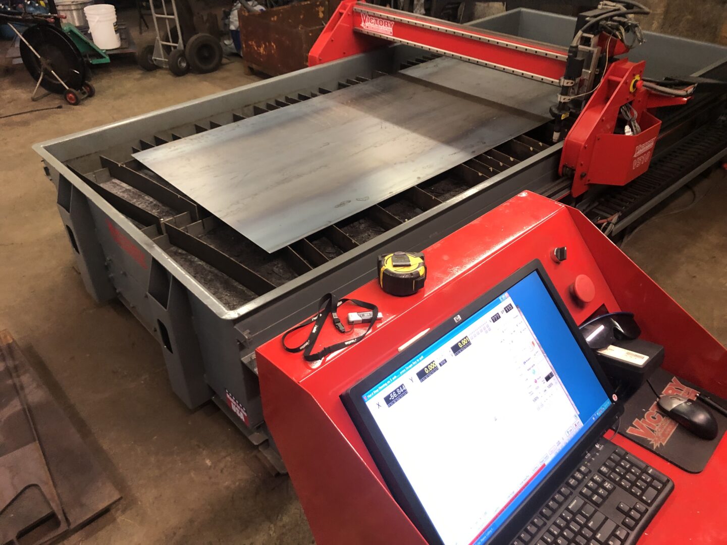 Laser cutting machine sparks on metal plate